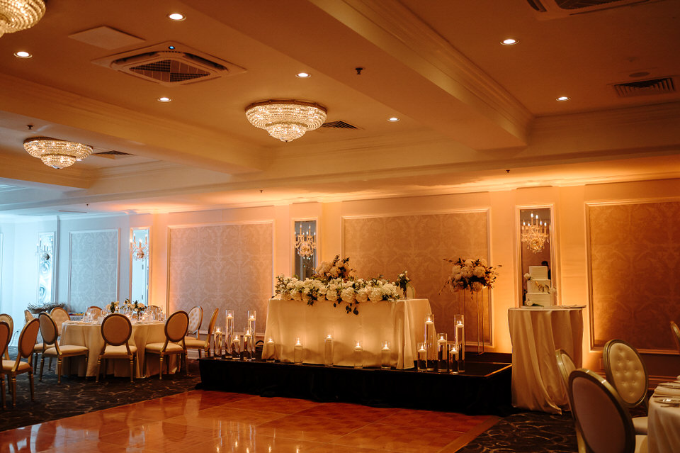 Wedding reception room at Château Vaudreuil with warm evening lighting