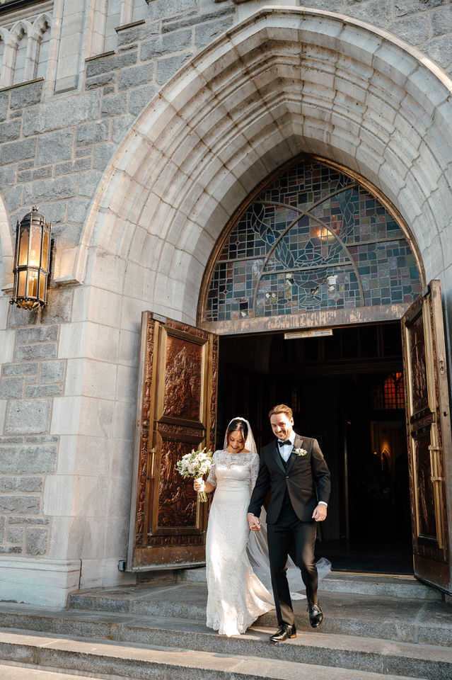 Newlyweds leaving Sainte-Cécile Basilica-Cathedral after their wedding ceremony