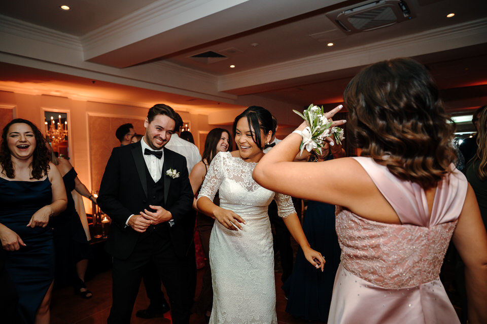 Guests dancing on the dance floor during the wedding reception at Château Vaudreuil